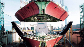 A giant bow suspended over a ship